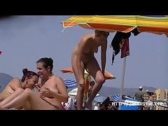 Nice women sunbathing on beach in France