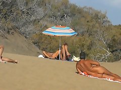 Public pussy fingering at the beach