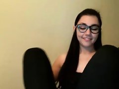 A cute brunette with glasses masturbating